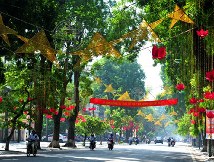 Streets of Hanoi crowded with people and national flags on National Day